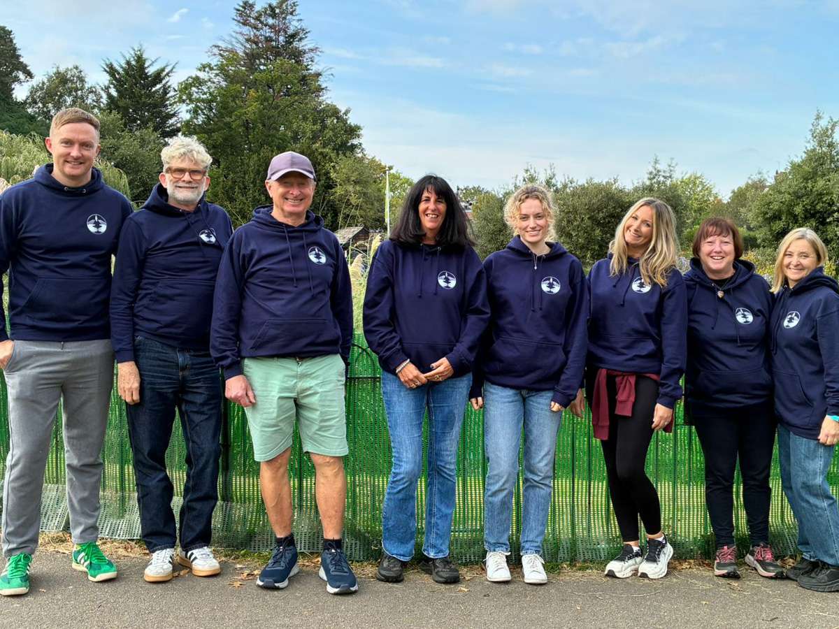 The Compassionate Friends team wearing printed navy hoodies