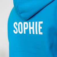 A trip hoodie with the student's individual name printed on the back