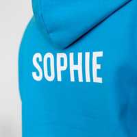 A trip hoodie with the student's individual name printed on the back