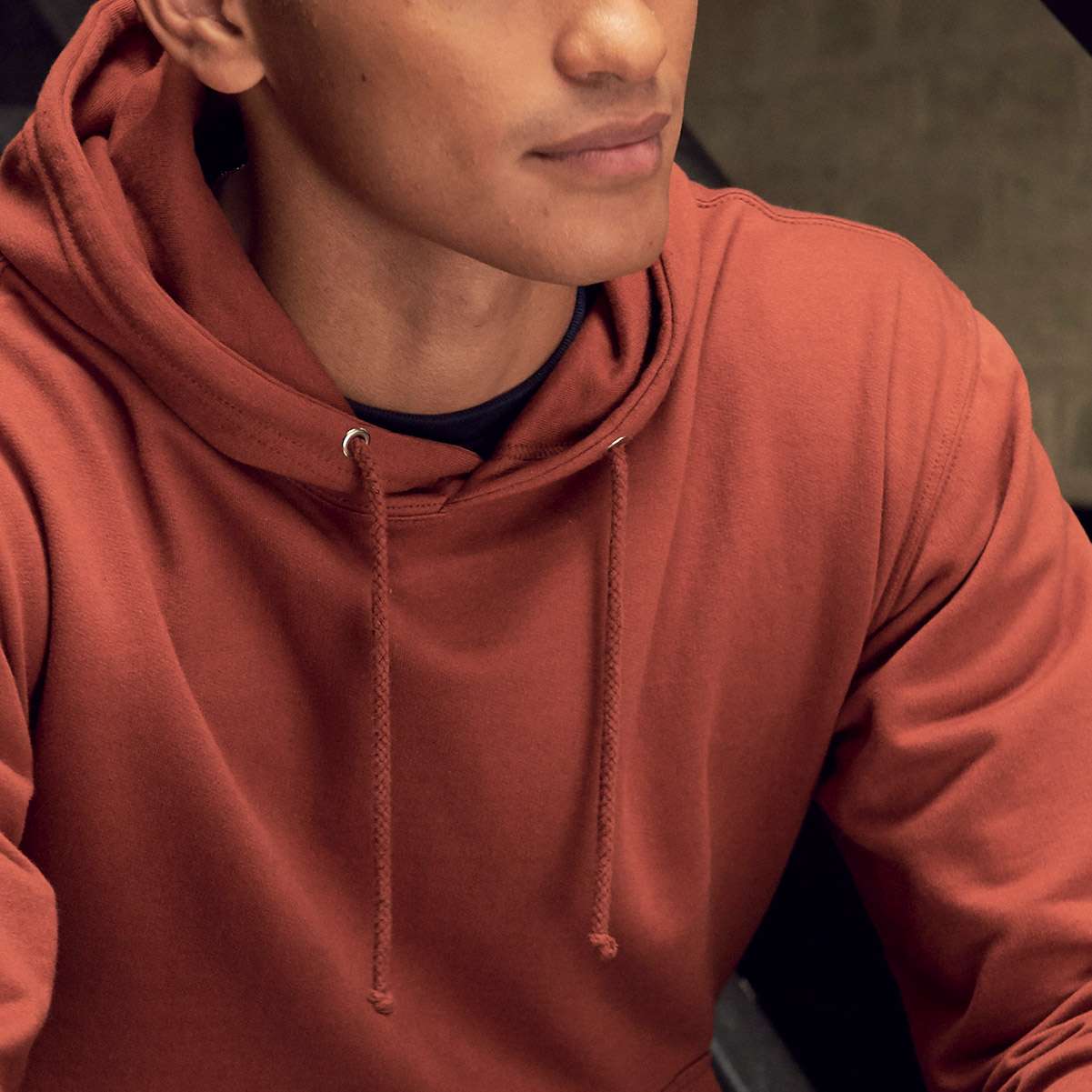 A close up of a student wearing a pullover hoodie