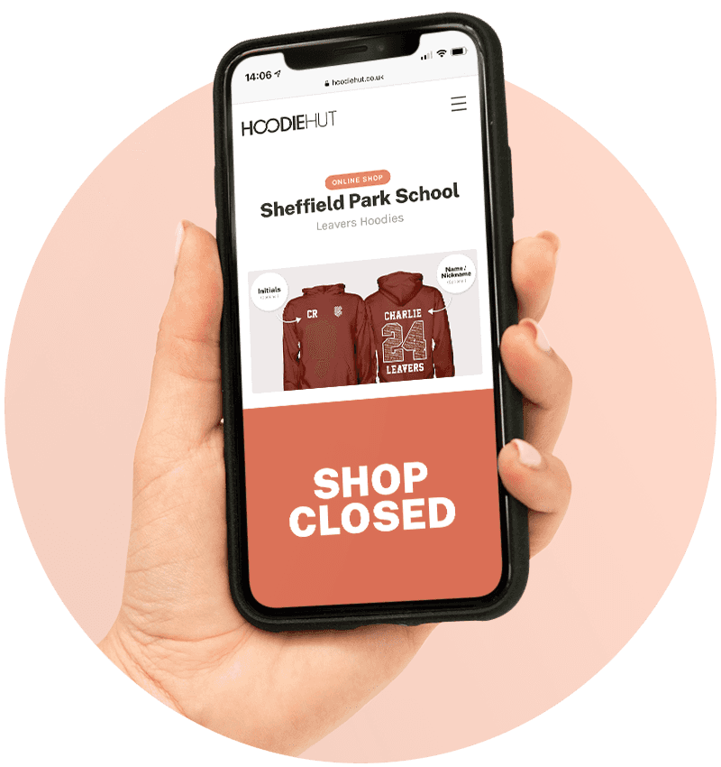 hand holding a phone showing that our online shop has closed