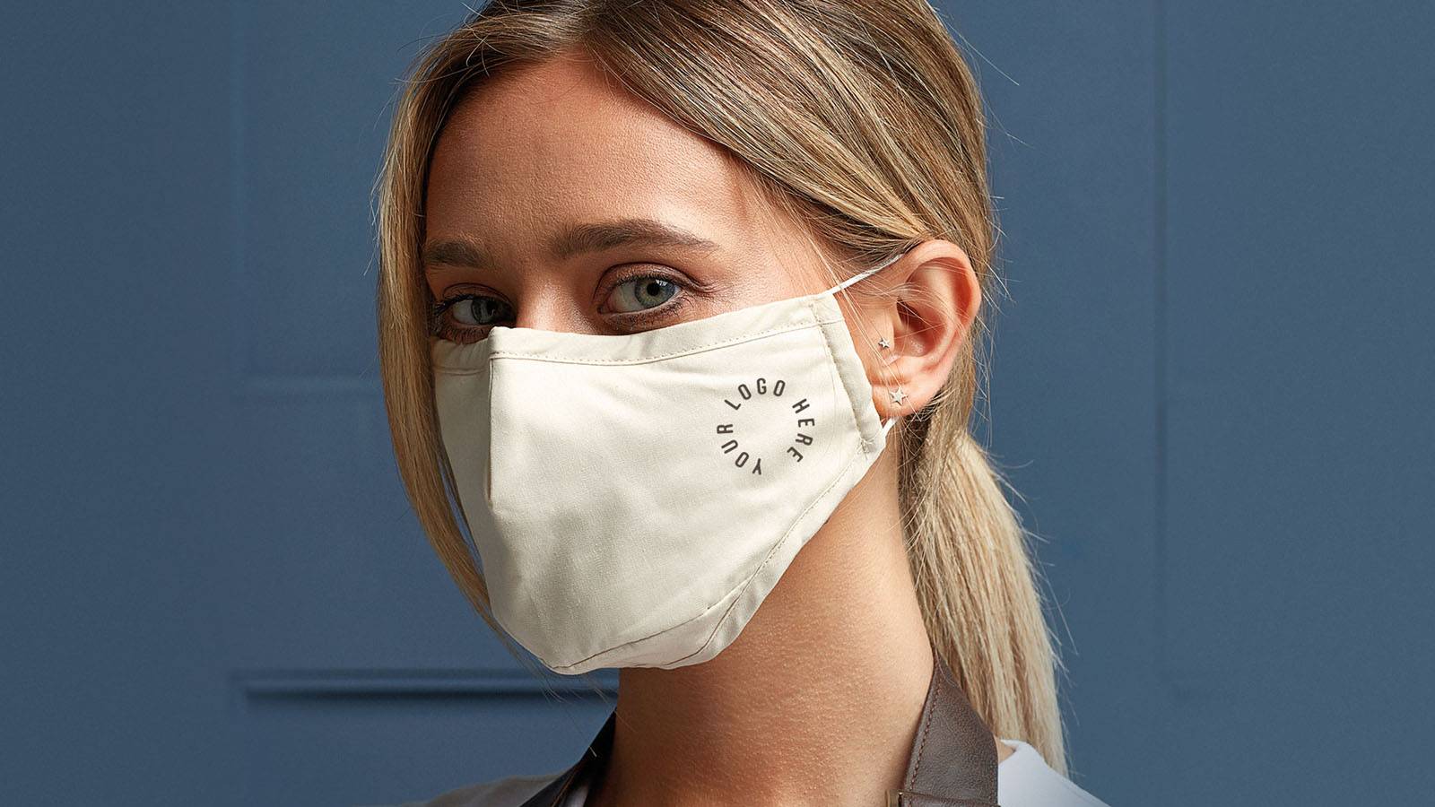 printed face masks for schools teacher wearing a face covering with a logo printed on it