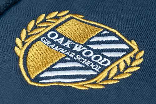 a school logo that has been embroidered on to the front of a leavers hoodie