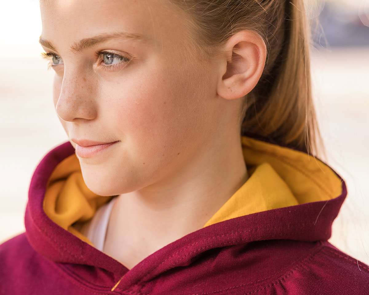 close-up of girl in hoodie showing collar and hood style