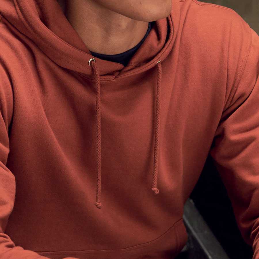 close-up photo of our hoodie in a red rust colour